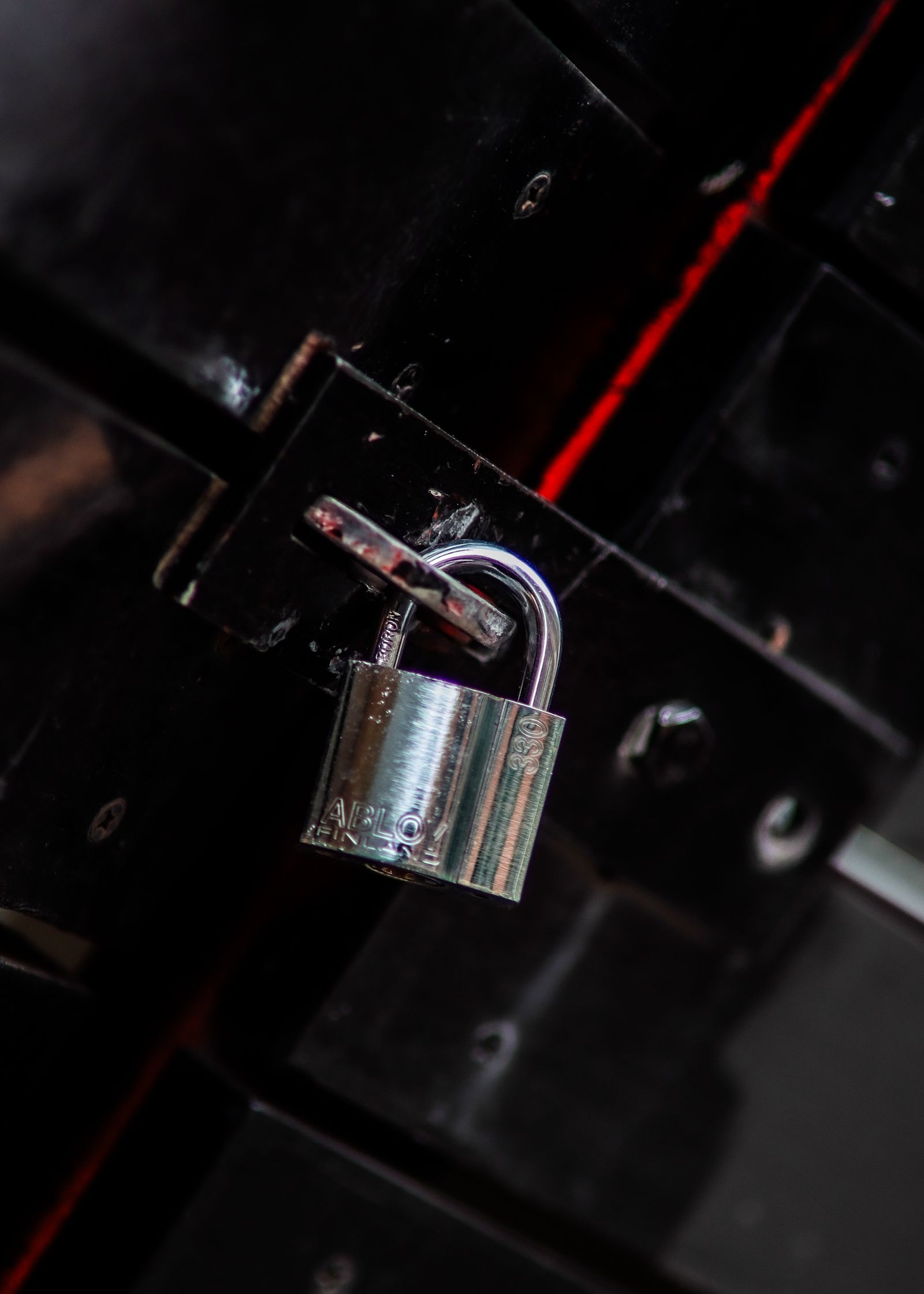 A locksmith rekeying a lock cylinder at a workbench