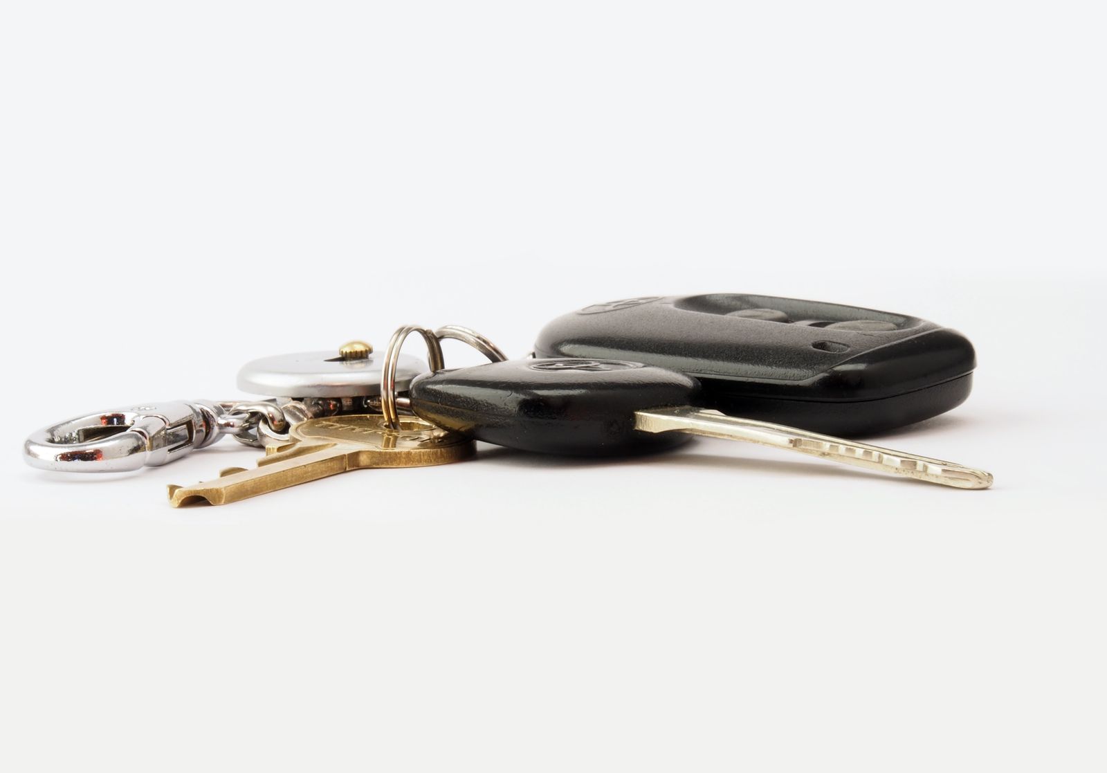 A locksmith cutting and programming a replacement car key